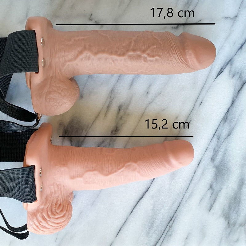 Zijaanzicht van stevige holle vibrerende strap-on toont ergonomisch harnas en vormgeving
